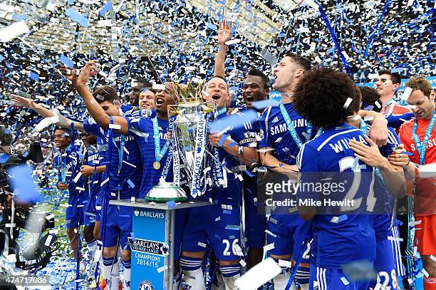 John Terry of Chelsea celebrates lifts the trophy alongside team mates after the Barclays Premier League match between Chelsea and Sunderland at...