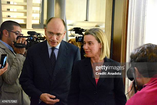 European Union Foreign Policy chief Federica Mogherini and former Italian Prime Minister Enrico Letta walk as Mogherini receives the 2015 prize of...