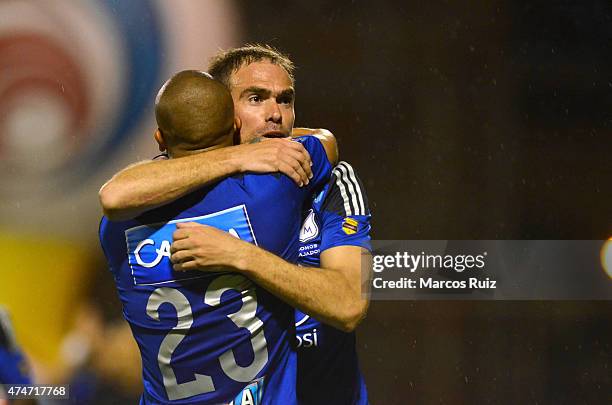 Federico Insua of Millonarios celebrates with his teammate Lewis Ochoa after scoring the first goal of his team during a second leg match between...