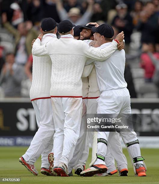 Moeen Ali of England is modded by teammates after catching out Trent Boult of New Zealand to win the 1st Investec Test match between England and New...