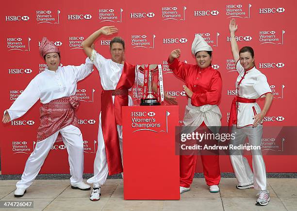 Shanshan Feng of China, Suzann Pettersen of Norway, Inbee Park of South Korea and Paula Creamer of the USA strike a pose next to the trophy during a...