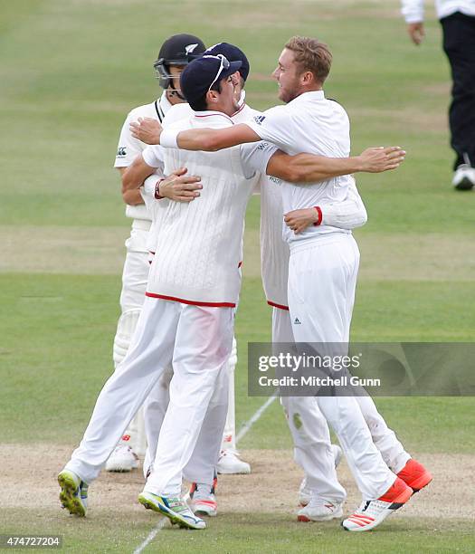 Stuart Broad of England celebrates taking the wicket of Trent Boult of New Zealand during day five of the 1st Investec Test match between England and...