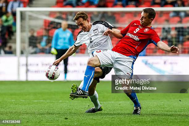 Pavel Kuka of Czech Republic battles for the ball with Jorg Heinrich of Germany during legends match between Czech Republic and Germany at Eden...