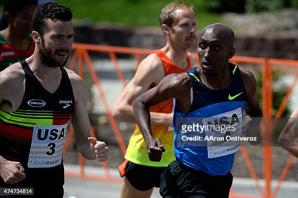 Runner Abdi Abdirahman checks out countryman Bobby Curtis during the Bolder Boulder. People competed in the annual 10k road race on Monday, May 25,...