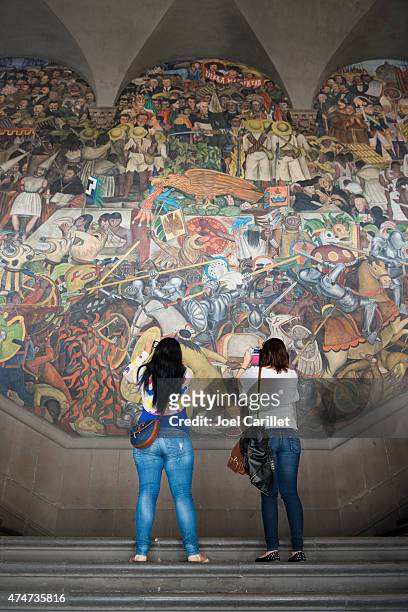 photographing a diego rivera mural in mexico city - diego rivera stock pictures, royalty-free photos & images