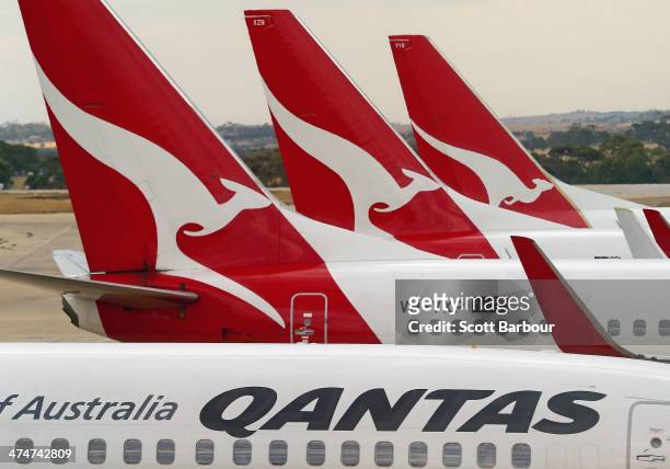 Qantas aeroplanes wait at Melbourne Tullamarine Airport on February 25, 2014 in Melbourne, Australia. On Thursday Qantas will announce their half...