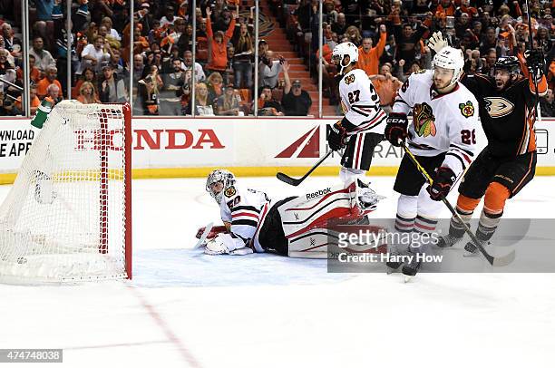 Ryan Kesler of the Anaheim Ducks celebrates his first period goal as goaltender Corey Crawford, Kyle Cumiskey and Johnny Oduya of the Chicago...