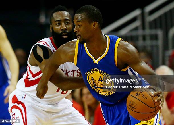 Harrison Barnes of the Golden State Warriors drives against James Harden of the Houston Rockets in the first quarter during Game Four of the Western...
