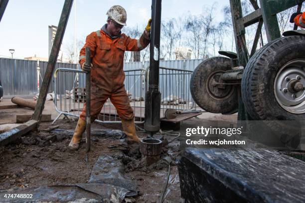 london workman a drilling a borehole - geology tools stock pictures, royalty-free photos & images
