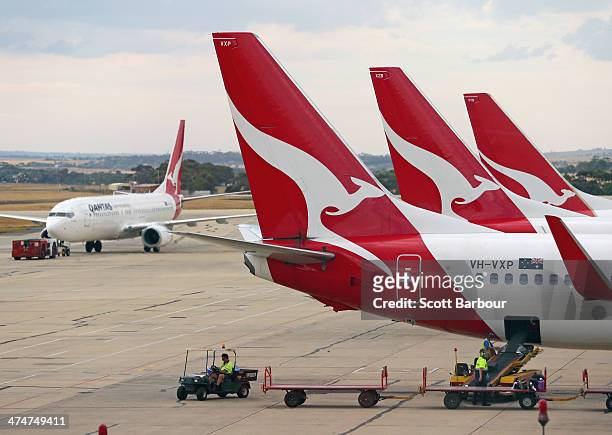 Baggage is loaded onto a Qantas aeroplane as it waits at Melbourne Tullamarine Airport on February 25, 2014 in Melbourne, Australia. On Thursday...