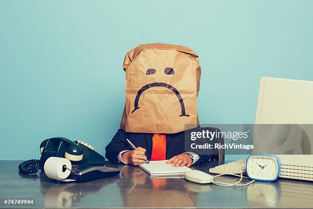 young boy businessman wears sad face - sad business stock pictures, royalty-free photos & images