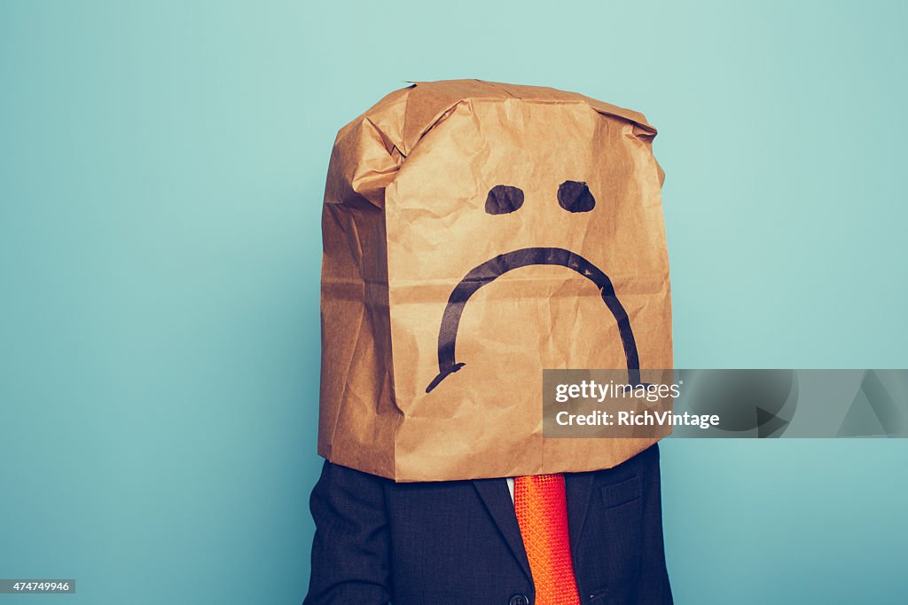 Young Boy Businessman Wears Sad Face