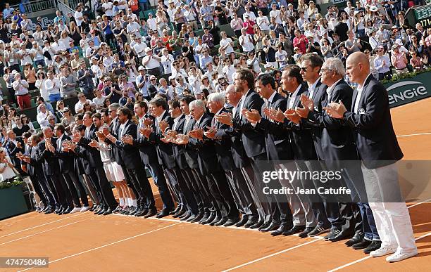 Members of the French Davis Cup Players' Club attend the tribute on Center Court honoring the late French tennis champion Patrice Dominguez on day 1...