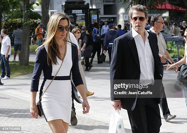 Hugh Grant and Anna Elisabet Eberstein attend day 1 of the French Open 2015 held at Roland Garros stadium on May 24, 2015 in Paris, France.