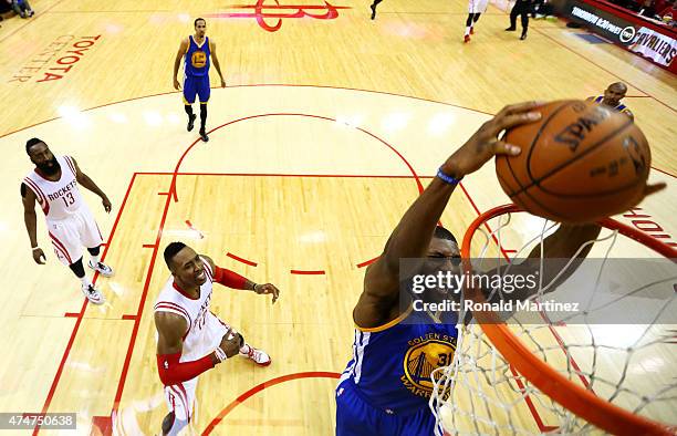 Festus Ezeli of the Golden State Warriors dunks against the Houston Rockets in the first half during Game Four of the Western Conference Finals of...