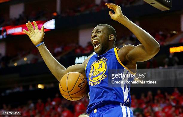 Festus Ezeli of the Golden State Warriors dunks against the Houston Rockets in the third quarter during Game Four of the Western Conference Finals of...