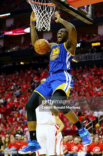 Festus Ezeli of the Golden State Warriors dunks against the Houston Rockets in the third quarter during Game Four of the Western Conference Finals of...