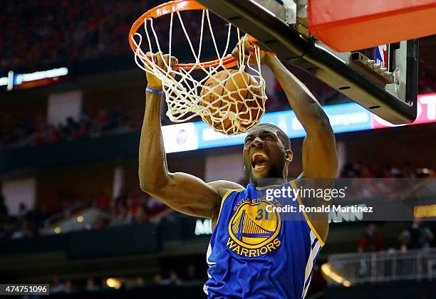 Festus Ezeli of the Golden State Warriors dunks against the Houston Rockets in the third quarter during Game Four of the Western Conference Finals of...