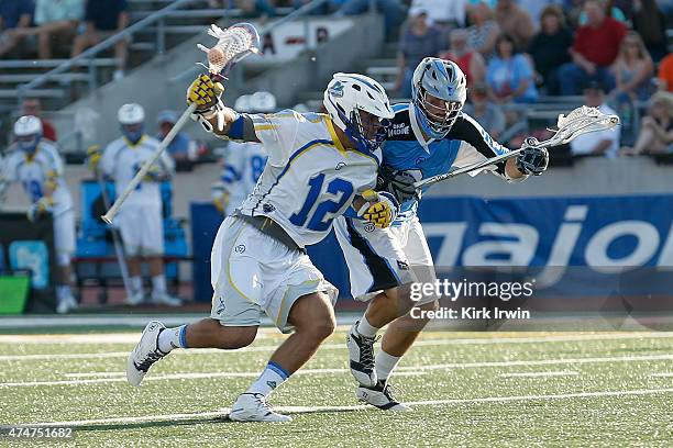 Duncan Clancy of the Florida Launch attempts to run the ball past Dan Groot of the Ohio Machine during the game on May 24, 2015 at Selby Stadium in...
