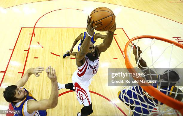 Dwight Howard of the Houston Rockets shoots against Andrew Bogut of the Golden State Warriors in the second half during Game Four of the Western...