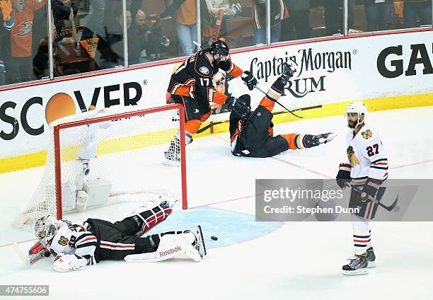 Matt Beleskey of the Anaheim Ducks celebrates scoring the game winning goal with teammate Ryan Kesler as goaltender Corey Crawford of the Chicago...