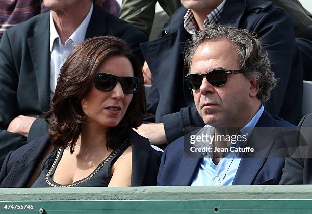Luc Chatel and his girlfriend Mahnaz Hatami attends day 2 of the French Open 2015 at Roland Garros stadium on May 25, 2015 in Paris, France.