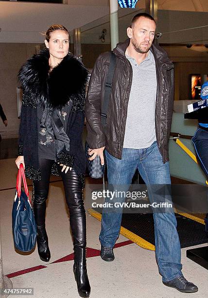Heidi Klum and her boyfriend Martin Kristen are seen at Los Angeles International Airport on November 01, 2012 in Los Angeles, California.