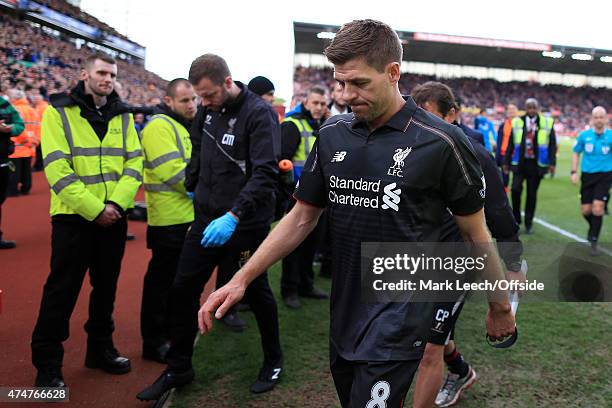 Steven Gerrard of Liverpool carries his captain's armband with him as he walks off dejected after his last game for the club following the Barclays...