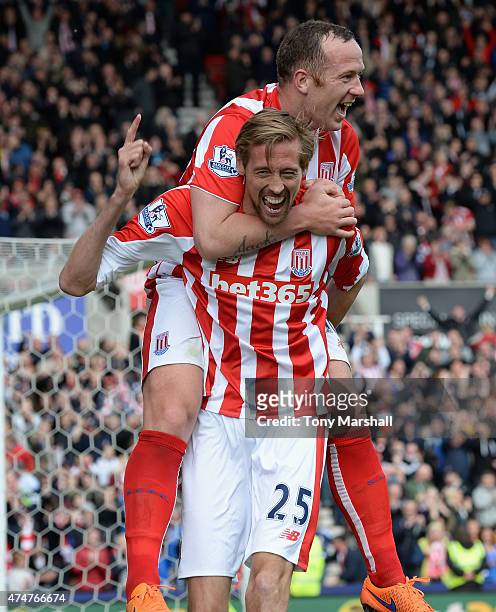 Peter Crouch of Stoke City celebrates after scoring their sixth goal with Charlie Adam during the Barclays Premier League match between Stoke City...