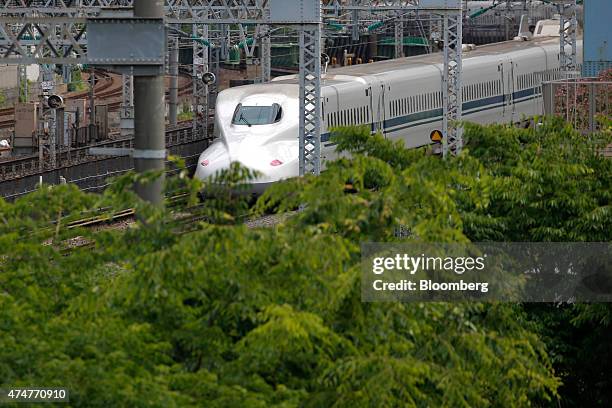 Central Japan Railway Co. N700 series Shinkansen bullet train travels along a railway track in Tokyo, Japan, on Sunday, May 24, 2015. Japan was first...