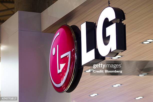 Logo sits above the LG Electronics Inc. Pavilion on the opening day of the Mobile World Congress in Barcelona, Spain, on Monday, Feb. 24, 2014. Top...