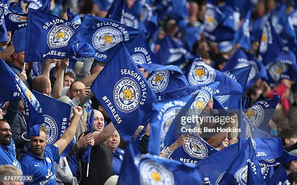 Leicester fans wave flags during the Premier League match between Leicester City and Queens Park Rangers at The King Power Stadium on May 24, 2015 in...