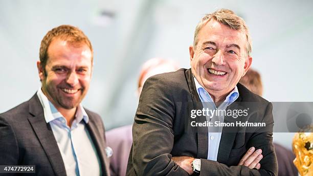 President Wolfgang Niersbach and Hansi Flick smile during the DFB Ehrenrunde Kick-Off event on May 26, 2015 in Frankfurt am Main, Germany.