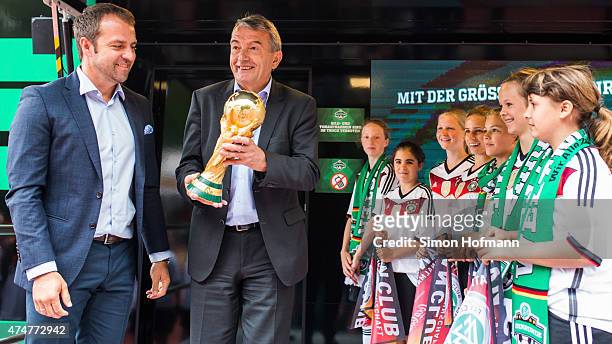 President Wolfgang Niersbach and Hansi Flick smile during the DFB Ehrenrunde Kick-Off event on May 26, 2015 in Frankfurt am Main, Germany.