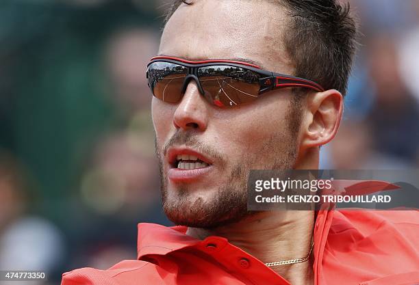 Poland's Jerzy Janowicz returns the ball to France's Maxime Hamou during the men's first round of the Roland Garros 2015 French Tennis Open in Paris...