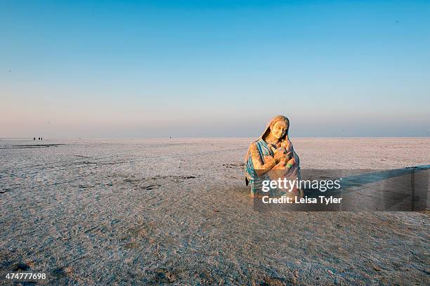 Religions statue, believed to have been dumped after a Hindu festival in the nearby town of Hodka, stands at the edge of the Great Rann of Kutch, a...