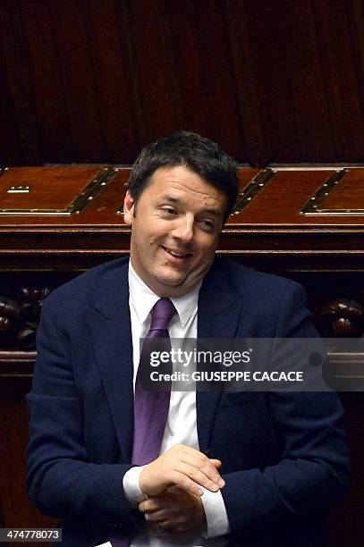 Newly appointed Italian Prime Minister Matteo Renzi gestures at the Italian Parliament during the second day of a debate for a confidence vote on...