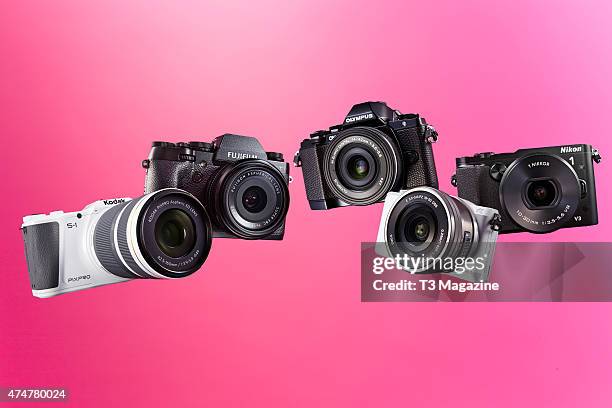 Selection of compact system digital cameras, including a Kodak PixPro S-1, Fujifilm X-T1, Olympus OM-D E-M10, Sony A5100 and a Nikon 1 V3, taken on...