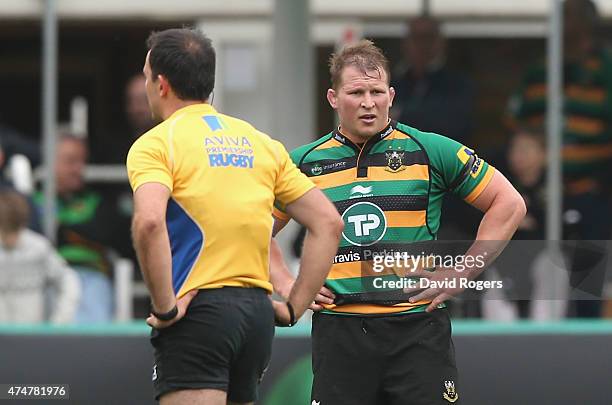 Dylan Hartley, the Northampton Saints captain looks on with referee Greg Garner, during the Aviva Premiership play off semi final match between...