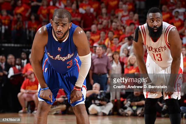 Chris Paul of the Los Angeles Clippers stands on the court in Game Seven of the Western Conference Semifinals with James Harden of the Houston...
