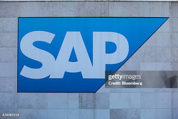 The SAP AG logo sits on display outside the business-software maker's headquarters in Walldorf, Germany, on Monday, Feb. 24, 2014. SAP AG co-Chief...