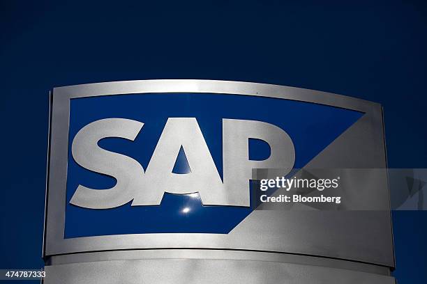 The SAP AG logo sits on a sign standing outside the business-software maker's headquarters in Walldorf, Germany, on Monday, Feb. 24, 2014. SAP AG...