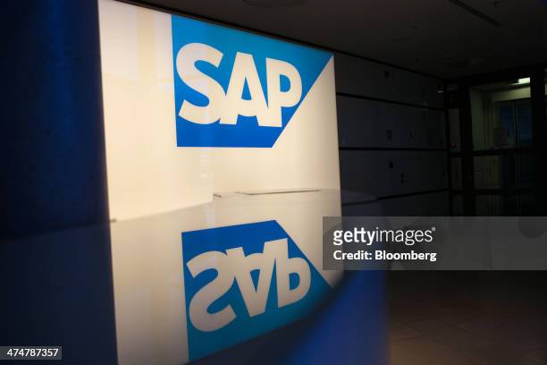An illuminated SAP AG logo sits on display inside the business-software maker's headquarters in Walldorf, Germany, on Monday, Feb. 24, 2014. SAP AG...