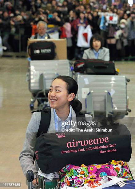 Mao Asada is welcomed by fans upon arrival from the Sochi Winter Olympics at the Narita International Airport on February 25, 2014 in Narita, Chiba,...