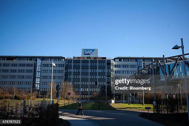 Visitor passes outside the headquarters of SAP AG in Walldorf, Germany, on Monday, Feb. 24, 2014. SAP AG co-Chief Executive Officer Bill McDermott,...