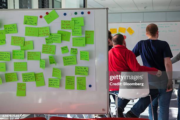 Post-it notes sit on a white board as employees brainstorm in an office inside the SAP AG headquarters in Walldorf, Germany, on Monday, Feb. 24,...