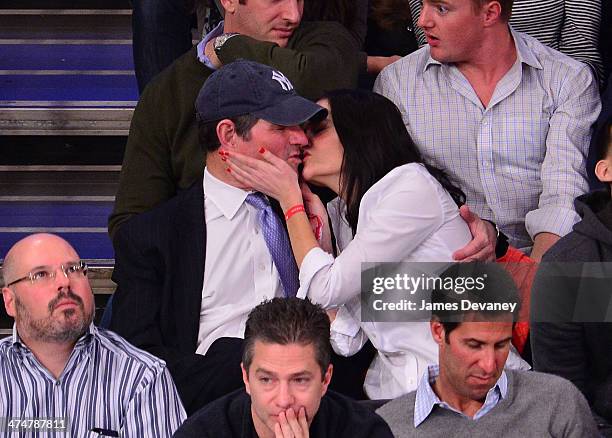 Eliot Spitzer and Lis Smith attend the Dallas Mavericks vs New York Knicks game at Madison Square Garden on February 24, 2014 in New York City.