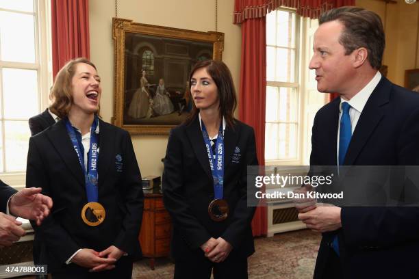 Lizzy Yarnold and Eve Muirhead of Great Britain laugh with British Prime Minister David Cameron at 10 Downing Street on February 25, 2014 in London,...