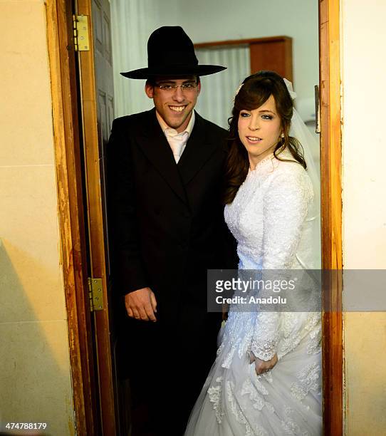 The bride and the groom poses on 23 February 2014 dated picture which shows the ultra-orthodox jews holding a traditional wedding ceremony in...