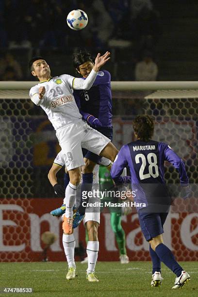 Shao Jiayi of Beijing Guoan and Kazuhiko Chiba of Sanfrecce Hiroshima compete for the ball during the AFC Champions League match between Sanfrecce...